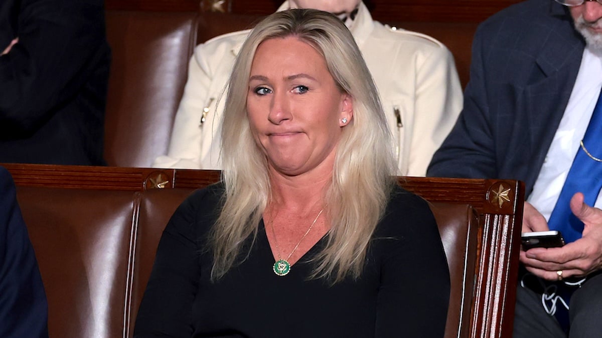 U.S. Rep. Marjorie Taylor Greene (R-GA) sits with fellow lawmakers as the House of Representatives votes for the third time on whether to elevate Rep. Jim Jordan (R-OH) to Speaker of the House