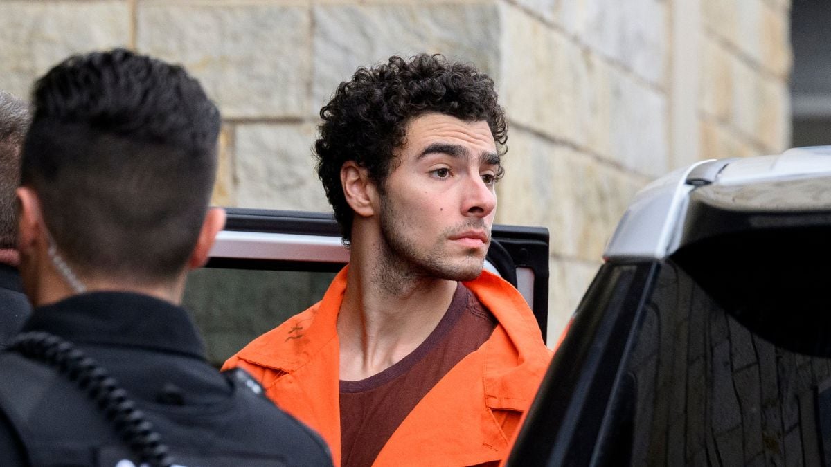 Suspected shooter Luigi Mangione is led into the Blair County Courthouse for an extradition hearing December 10, 2024 in Hollidaysburg, Pennsylvania