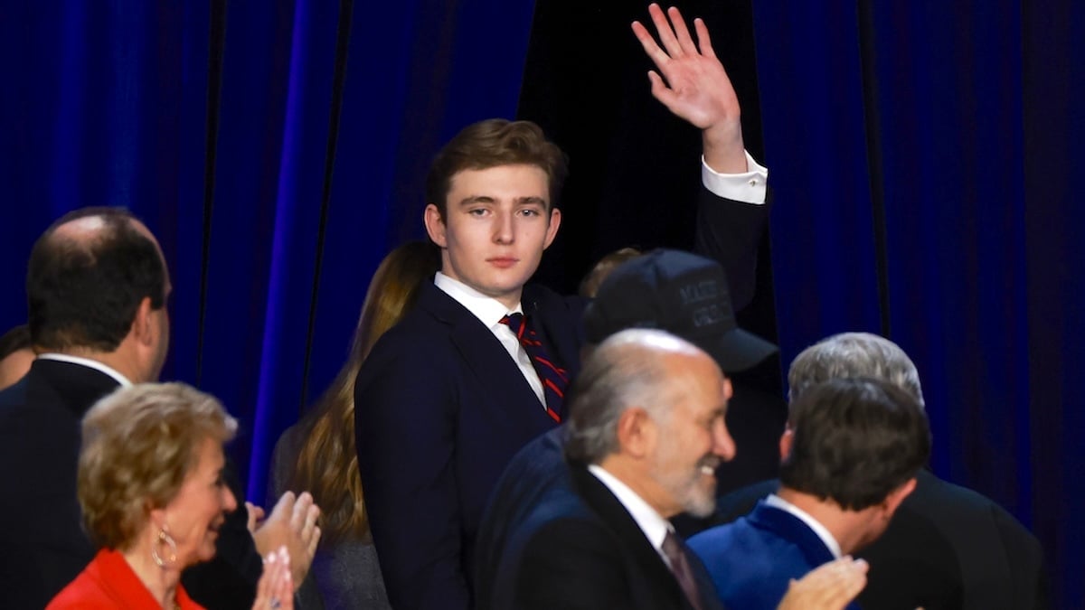 Barron Trump waves to supporters as he departs stage on election night event