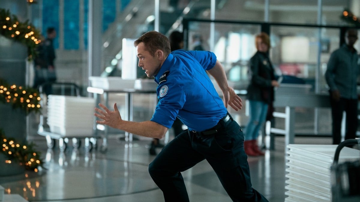 Taron Egerton runs in 'Carry-On'