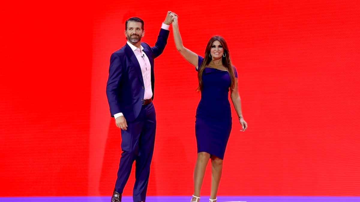 Donald Trump Jr. high fives Kimberly Guilfoyle on stage