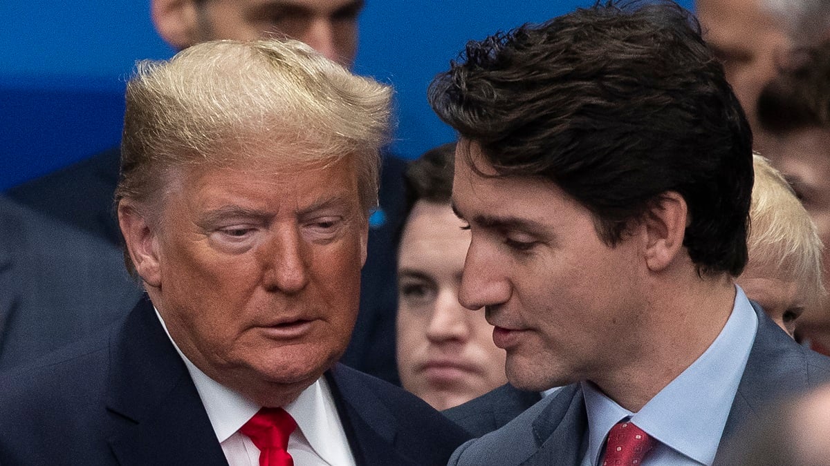 President Donald Trump (L) ad Canadian Prime Minister Justin Trudeau (R) attend the NATO summit at the Grove Hotel