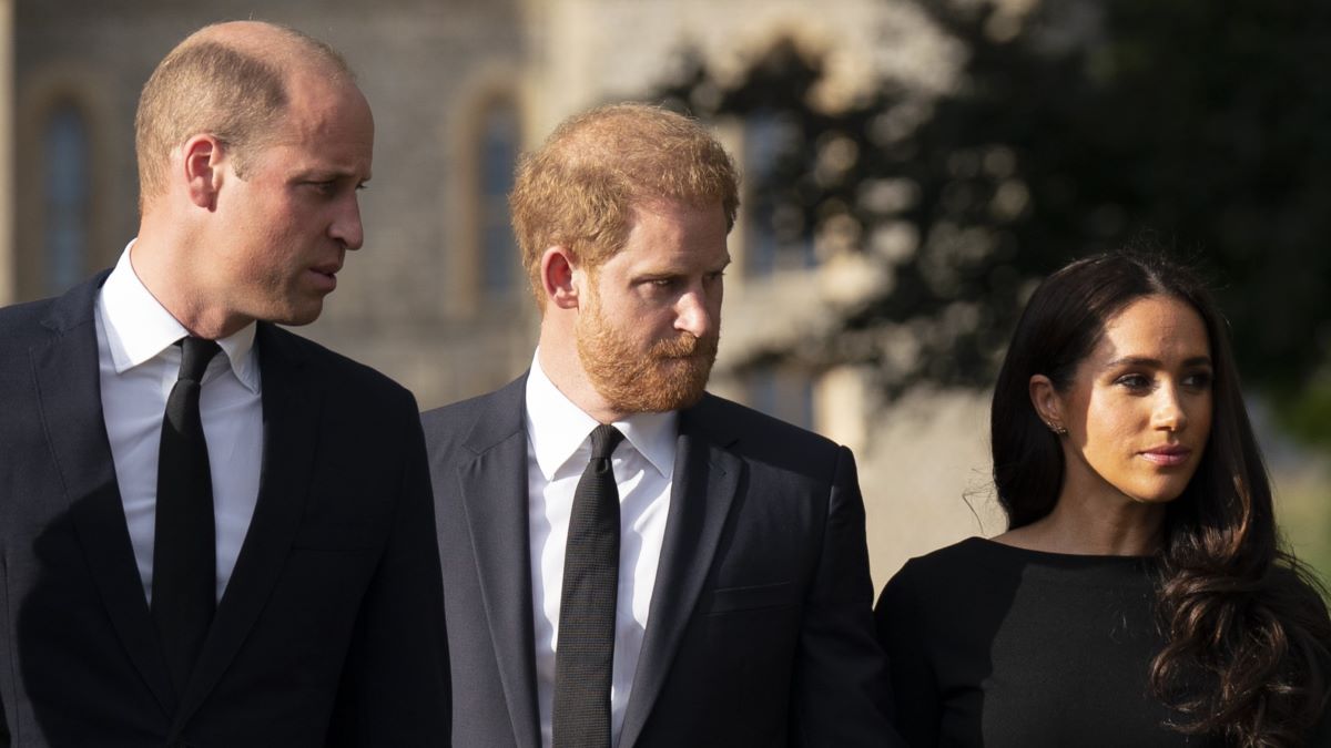 Prince William, Prince of Wales, Prince Harry, Duke of Sussex, and Meghan, Duchess of Sussex on the long Walk at Windsor Castle on September 10, 2022 in Windsor, England. Crowds have gathered and tributes left at the gates of Windsor Castle to Queen Elizabeth II, who died at Balmoral Castle on 8 September, 2022. (Photo by Kirsty O'Connor - WPA Pool/Getty Images)