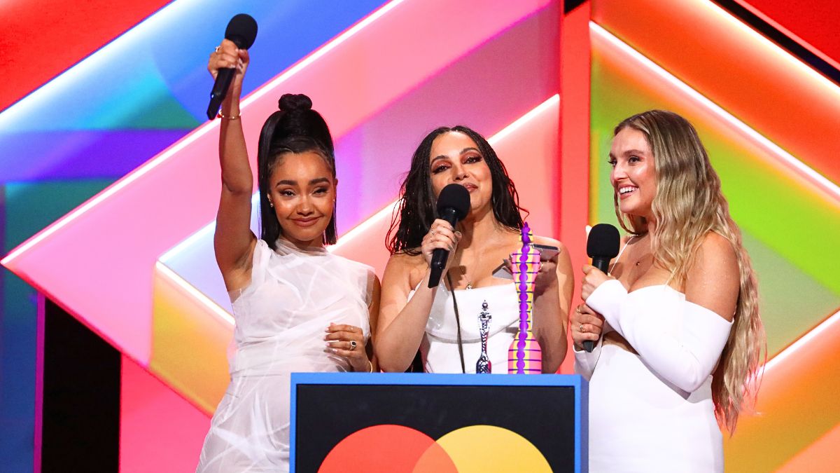 Leigh-Anne Pinnock, Jade Thirlwall and Perrie Edwards of Little Mix on stage after winning the British Group award during The BRIT Awards 2021 at The O2 Arena on May 11, 2021 in London, England.