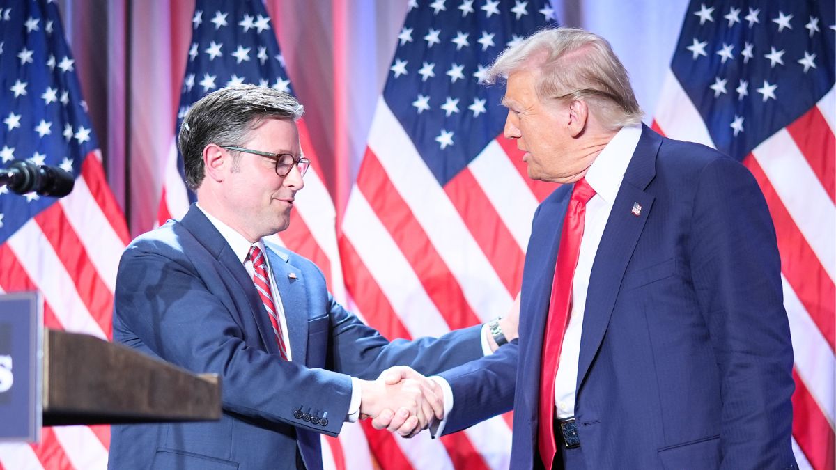 U.S. Speaker of the House Mike Johnson shakes hands with U.S. President-elect Donald Trump onstage at a House Republicans Conference meeting at the Hyatt Regency on Capitol Hill on November 13, 2024 in Washington, DC. As is tradition with incoming presidents, Trump is traveling to Washington, DC to meet with U.S. President Joe Biden at the White House as well as meet with Republican congressmen on Capitol Hill. (Photo by Andrew Harnik/Getty Images)