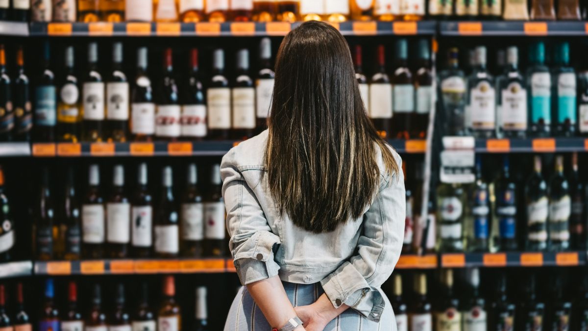 Woman perusing alcohol section