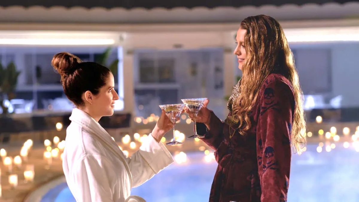 Blake Lively and Anna Kendrick clink glasses in 'Another Simple Favor'