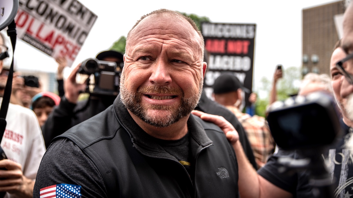 AUSTIN, TX - APRIL 18: Infowars founder Alex Jones interacts with supporters at the Texas State Capital building on April 18, 2020 in Austin, Texas. The protest was organized by Infowars host Owen Shroyer who is joining other protesters across the country in taking to the streets to call for the country to be opened up despite the risk of the COVID-19.