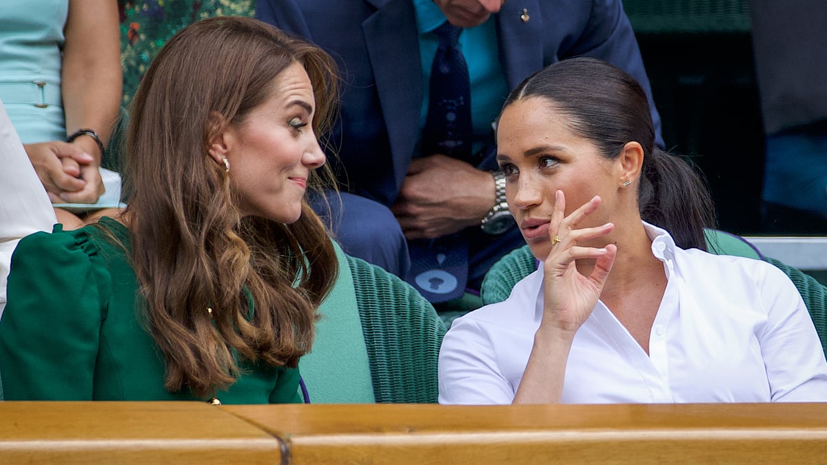 Catherine, Duchess of Cambridge talks with Meghan, Duchess of Sussex in the Royal Box on Centre Court ahead of the Ladies Singles Final between Simona Halep of Romania and Serena Williams of the United States on Centre Court during the Wimbledon Lawn Tennis Championships at the All England Lawn Tennis and Croquet Club at Wimbledon on July 13, 2019 in London, England.