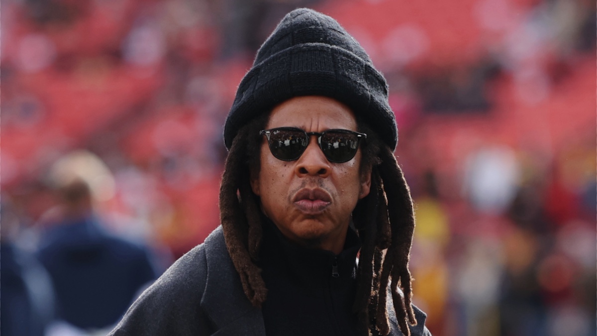 LANDOVER, MARYLAND - NOVEMBER 24: Rapper Jay-Z (C) looks on before a game between the Washington Commanders and the Dallas Cowboys at Northwest Stadium on November 24, 2024 in Landover, Maryland.