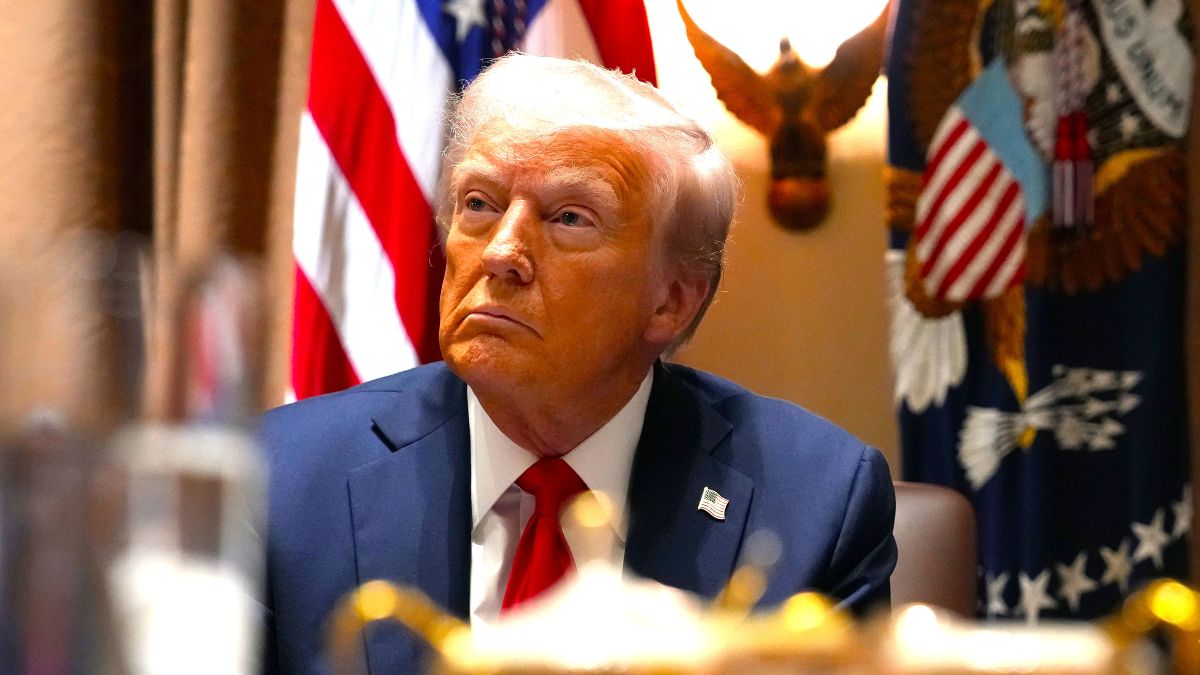 U.S. President Donald Trump listens during a Cabinet meeting at the White House on February 26, 2025 in Washington, DC. Trump is holding the first Cabinet meeting of his second term, joined by Tesla and SpaceX CEO Elon Musk, head of the Department of Government Efficiency (DOGE). (Photo by Andrew Harnik/Getty Images)