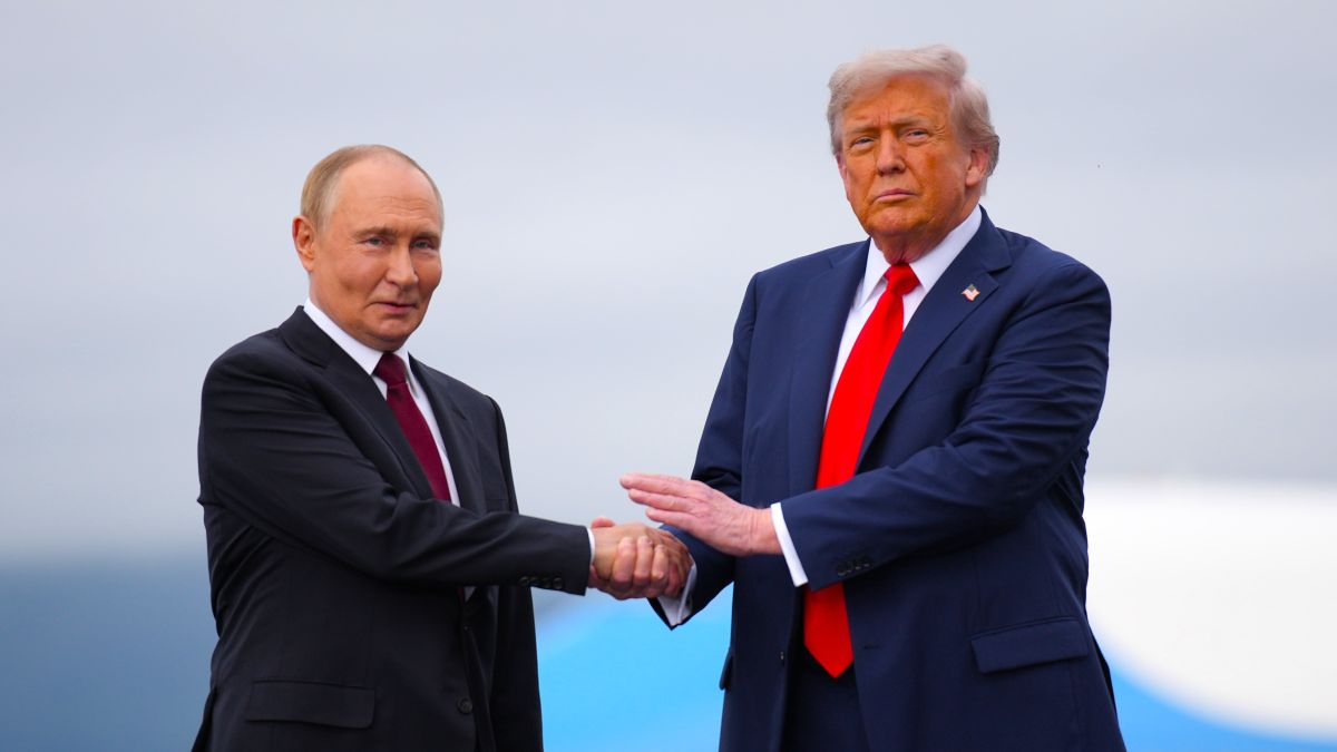U.S. President Donald Trump (R) greets Russian President Vladimir Putin as he arrives at Joint Base Elmendorf-Richardson on August 15, 2025 in Anchorage, Alaska. The two leaders are meeting for peace talks aimed at ending the war in Ukraine. (Photo by Andrew Harnik/Getty Images)