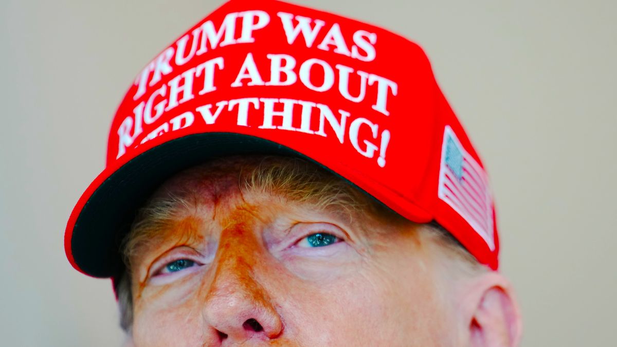U.S. President Donald Trump speaks to the media wearing a hat that reads, "Trump Was Right About Everything!," during a visit to The People's House: A White House Experience August 22, 2025 in Washington, DC. Trump spoke on a variety of issues including stating he did not know of the FBI raid currently happening on former national security adviser John Bolton's home, and saying he learned of it by seeing the news on television. (Photo by Kevin Dietsch/Getty Images)