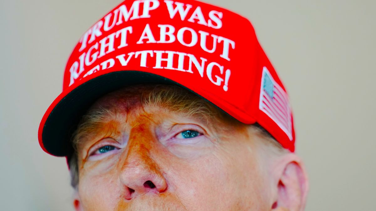 U.S. President Donald Trump speaks to the media wearing a hat that reads, "Trump Was Right About Everything!," during a visit to The People's House: A White House Experience August 22, 2025 in Washington, DC. Trump spoke on a variety of issues including stating he did not know of the FBI raid currently happening on former national security adviser John Bolton's home, and saying he learned of it by seeing the news on television. (Photo by Kevin Dietsch/Getty Images)