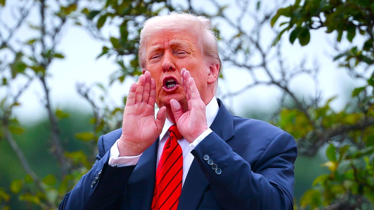 U.S. President Donald Trump shouts answers to questions from reporters as he tours the roof of the West Wing of the White House on August 05, 2025 in Washington, DC. Trump has undertaken several renovation projects at the White House to include the construction of a concrete patio at the Rose Garden. (Photo by Win McNamee/Getty Images)