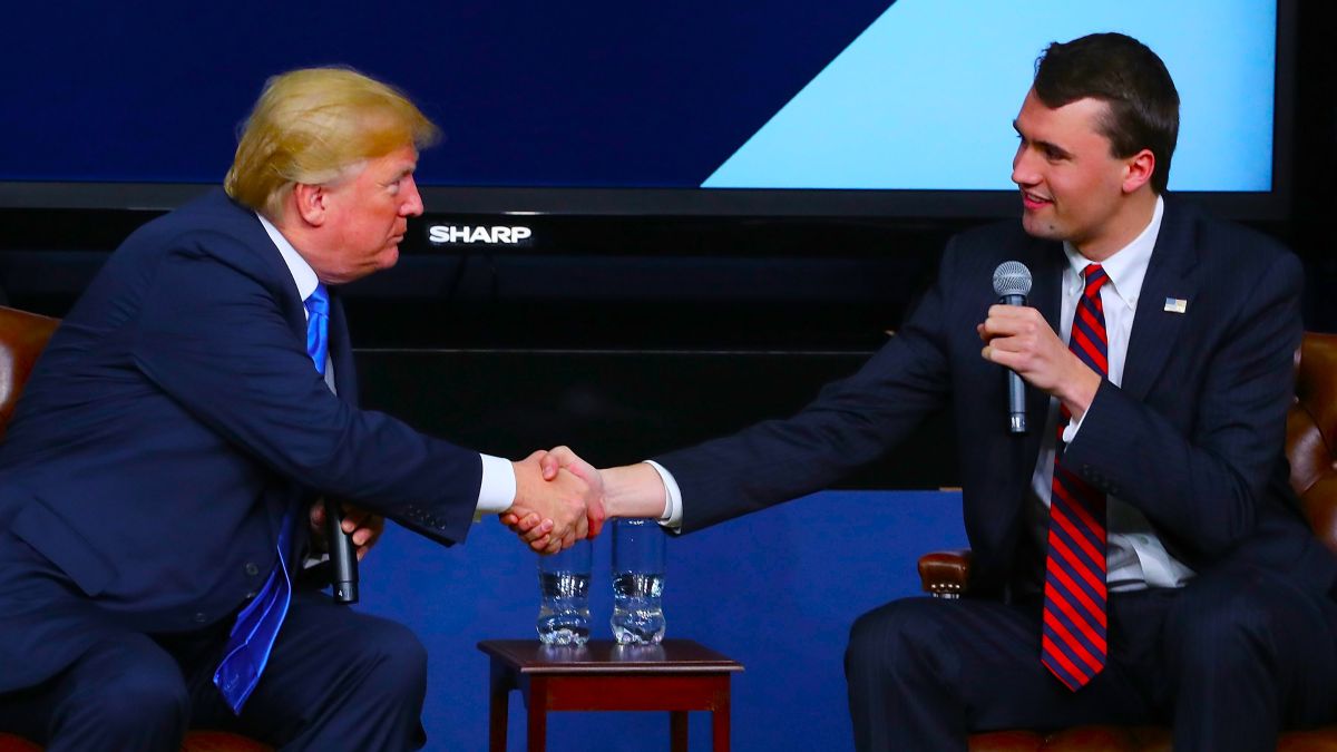 U.S. President Donald Trump shakes hands with conservative activist Charlie Kirk at a forum dubbed the Generation Next Summit at the White House on March 22, 2018 in Washington, DC. The meeting brought together young Americans with members of the Trump administration to discuss the economy, tax reform and the opioid crisis. Kirk is founder of Turning Point USA, a right-wing nonprofit organization that since 2016 has maintained a watchlist of university professors that it alleges "discriminate against conservative students and advance leftist propaganda in the classroom." (Photo by Mark Wilson/Getty Images)