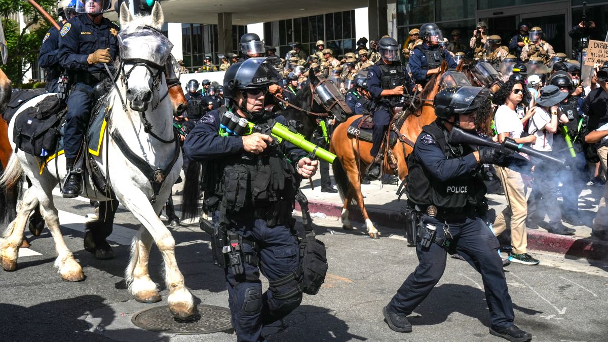 Los Angeles Police Department (LAPD) officers fire non-lethal weapons at protesters during No Kings Day on June 14, 2025 in Los Angeles, California. Marches and protests are taking place across the nation in opposition to Trump and recent ICE raids targeting immigrants. (Photo by Cristopher Rogel Blanquet/Getty Images)