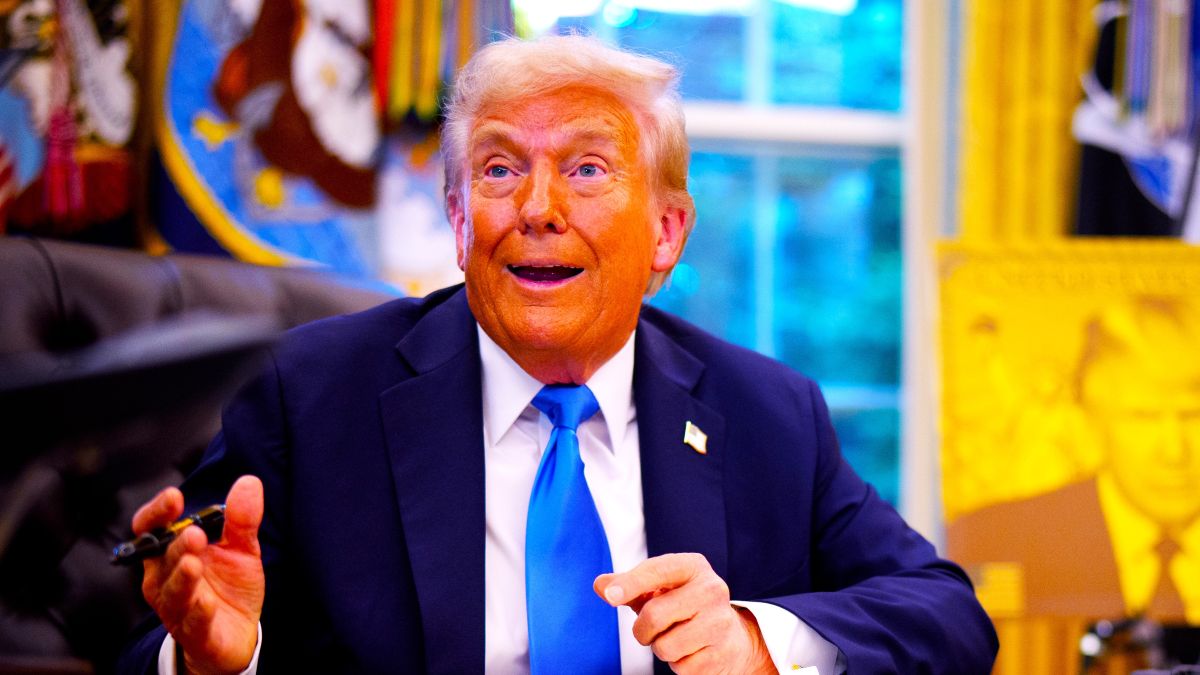 U.S. President Donald Trump reacts to a question from a reporter before signing an executive order in the Oval Office at the White House on September 19, 2025 in Washington, DC. Trump signed two executive orders, establishing the "Trump Gold Card" and introducing a $100,000 fee for H-1B visas. The "Trump Gold Card" is a visa program that allows foreign nationals permanent residency and a pathway to U.S. citizenship for a $1 million investment in the United States. (Photo by Andrew Harnik/Getty Images)