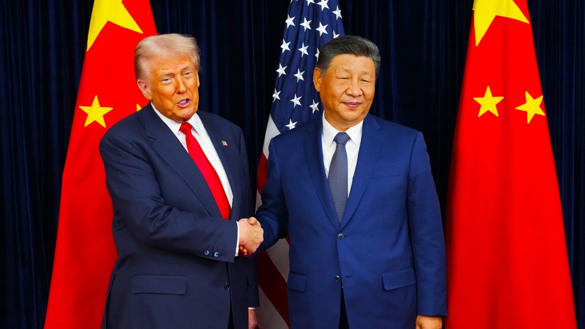 U.S. President Donald Trump greets Chinese President Xi Jinping ahead of a bilateral meeting at Gimhae Air Base on October 30, 2025 in Busan, South Korea. Trump is meeting Xi for the first time since taking office for his second term, following months of growing tension between both countries. (Photo by Andrew Harnik/Getty Images)