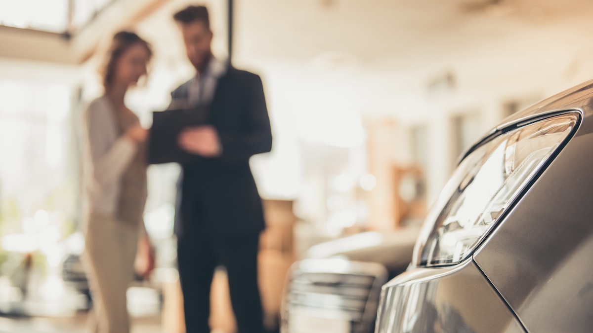 Young woman is talking to sales manager via Getty Images, vadimguzhva
