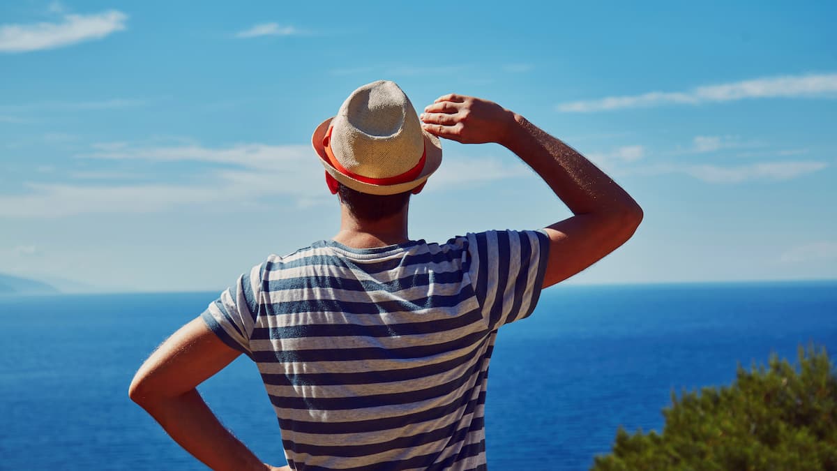 Attractive man enjoying on the tropical beach. Summer concept. - stock photo