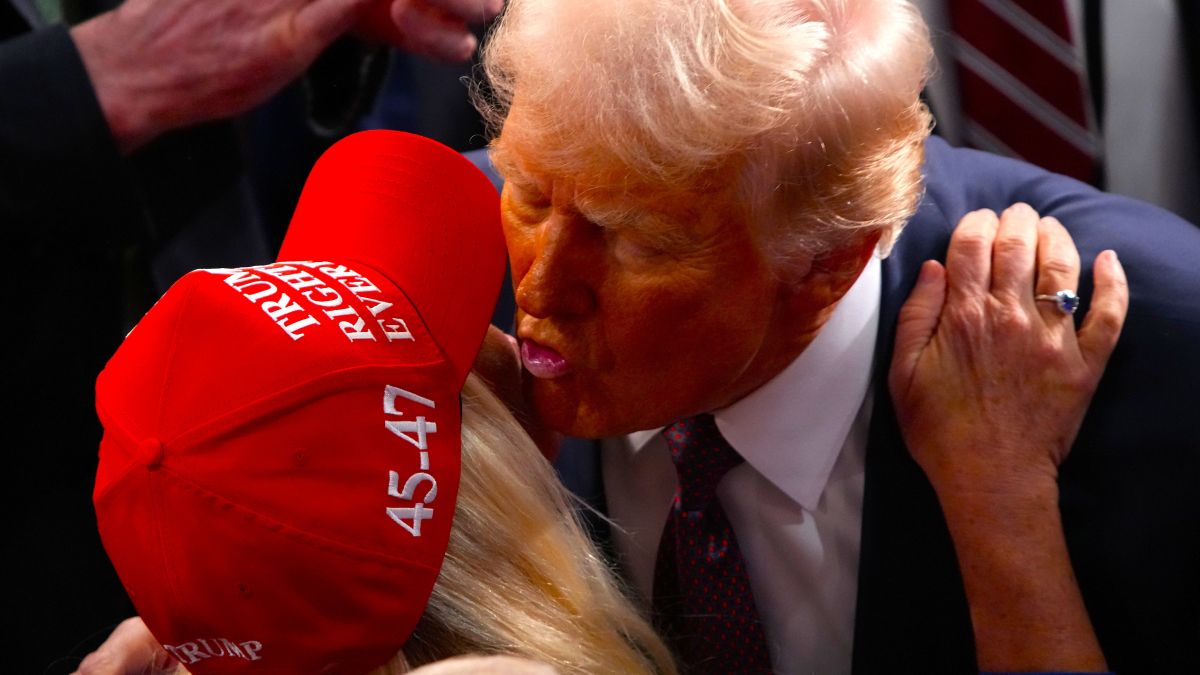 U.S. President Donald Trump kisses Rep. Marjorie Taylor Greene (R-GA) after addressing a joint session of Congress at the U.S. Capitol on March 04, 2025 in Washington, DC. President Trump was expected to address Congress on his early achievements of his presidency and his upcoming legislative agenda. (Photo by Andrew Harnik/Getty Images)