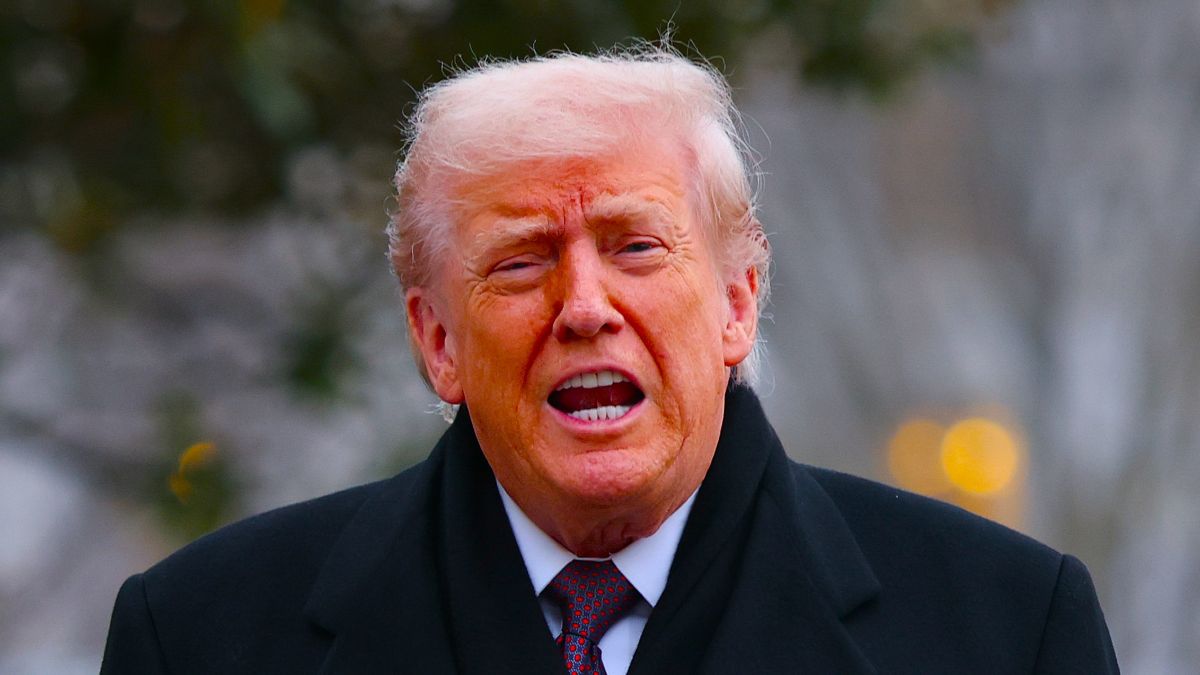 U.S. President Donald Trump shouts an answer to a reporter's question as he returns to the White House December 17, 2025 in Washington, DC. Earlier, Trump attended a dignified transfer ceremony at Dover Air Force Base for two members of the Iowa National Guard killed in Syria. (Photo by Win McNamee/Getty Images)