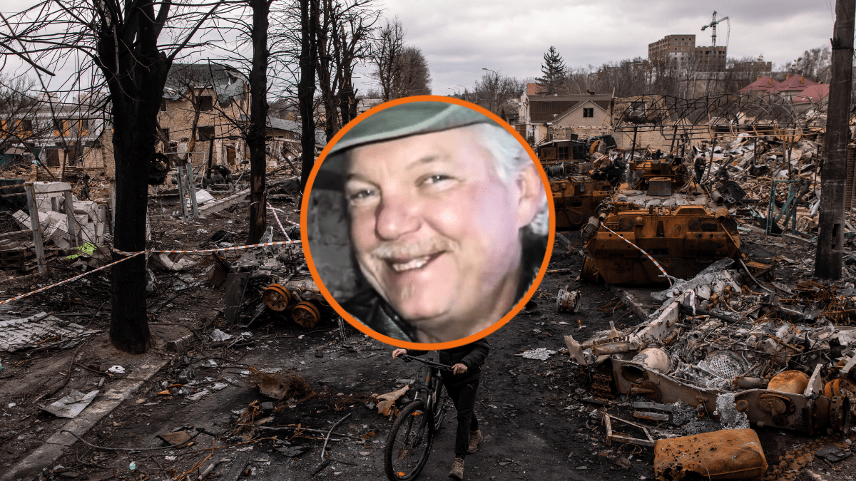 A man pushes his bike through debris and destroyed Russian military vehicles on a street on April 06, 2022 in Bucha, Ukraine. The Ukrainian government has accused Russian forces of committing a "deliberate massacre" as they occupied and eventually retreated from Bucha, 25km northwest of Kyiv. Hundreds of bodies have been found in the days since Ukrainian forces regained control of the town. (Photo by Chris McGrath/Getty Images)