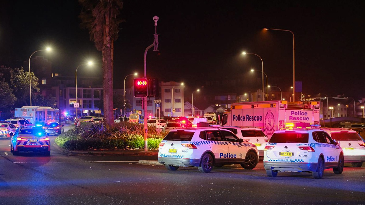 SYDNEY, AUSTRALIA - DECEMBER 14: Police cars are seen parked at at the scene of a mass shooting at Bondi Beach on December 14, 2025 in Sydney, Australia. Two gunmen dressed in black fired several shots at Sydney's world-famous Bondi Beach, causing at least 10 injuries and three deaths, and setting off mass panic on a Sunday evening. (Photo by George Chan/Getty Images)