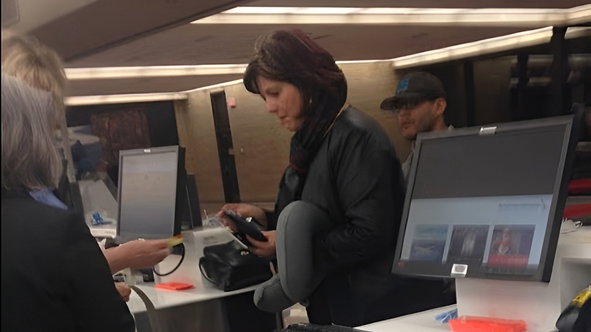 Debbie Bolton helping a father and his toddler in the Omaha, Nebraska airport