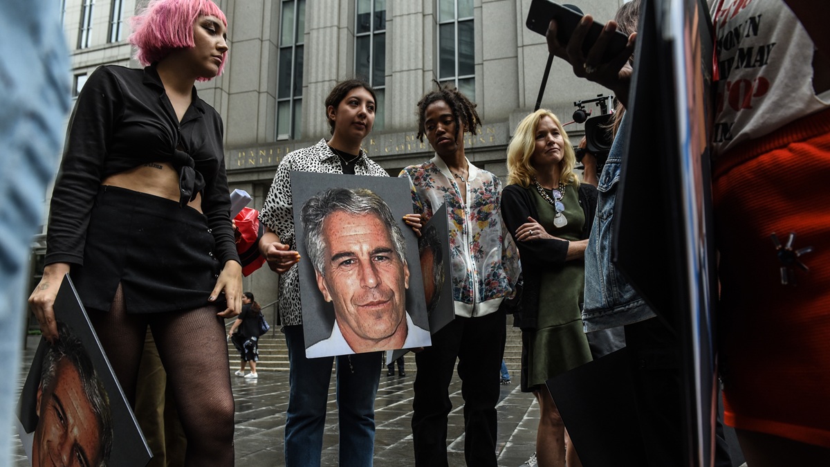 NEW YORK, NY - JULY 08: A protest group called "Hot Mess" hold up signs of Jeffrey Epstein in front of the Federal courthouse on July 8, 2019 in New York City. According to reports, Epstein will be charged with one count of sex trafficking of minors and one count of conspiracy to engage in sex trafficking of minors. (Photo by Stephanie Keith/Getty Images)