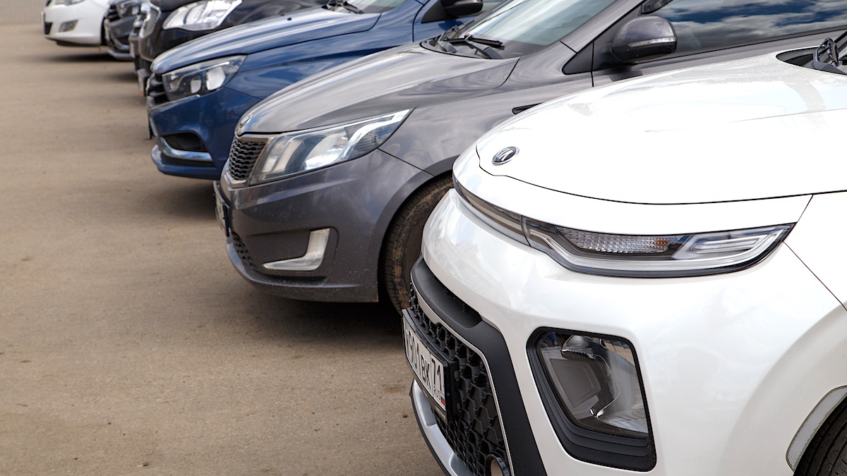 Row of cars on summer day parking via Getty Images, z1b