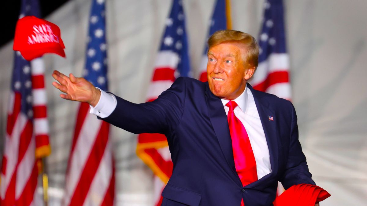 Former President Donald Trump tosses hats to supporters during a rally on August 05, 2022 in Waukesha, Wisconsin. Former President Trump endorsed Republican candidate Tim Michels in the governor's race against candidate Rebecca Kleefisch, who is supported by former Vice President Mike Pence. (Photo by Scott Olson/Getty Images)
