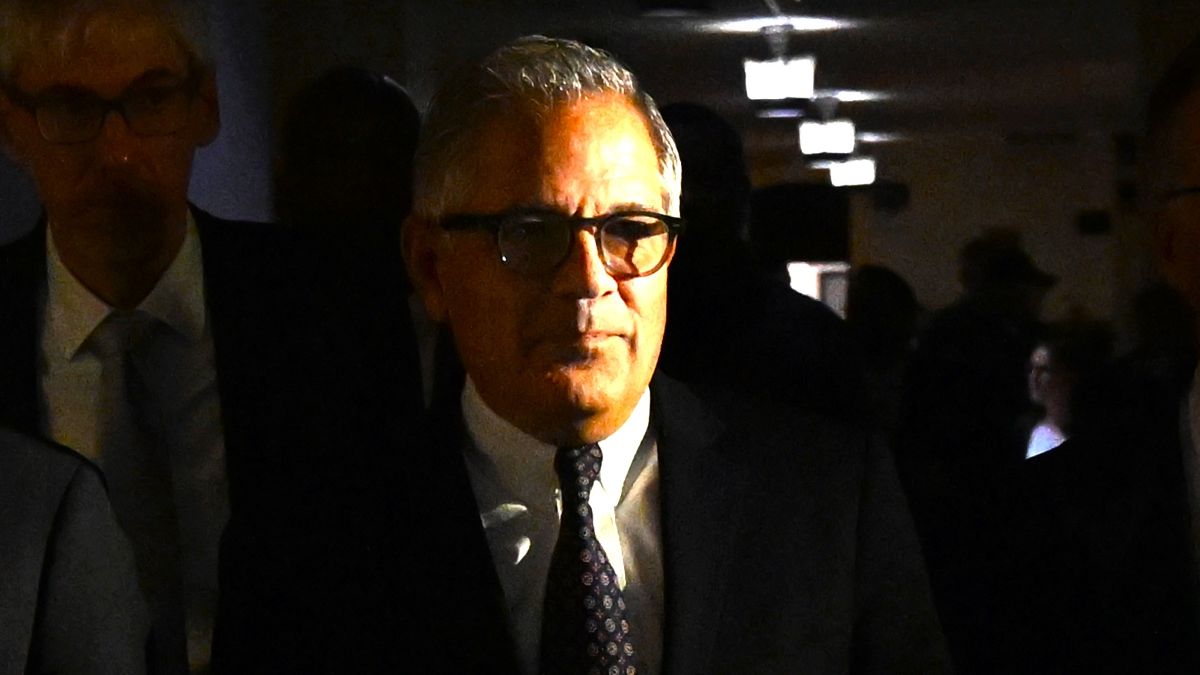 Philadelphia district attorney Larry Krasner (center) walks from the courtroom after a hearing over a lawsuit he filed against Elon Musk and his $1M giveaway petition contest on October 31, 2024 in Philadelphia, Pennsylvania. Elon Musk did not show up for the hearing. (Photo by Drew Hallowell/Getty Images)