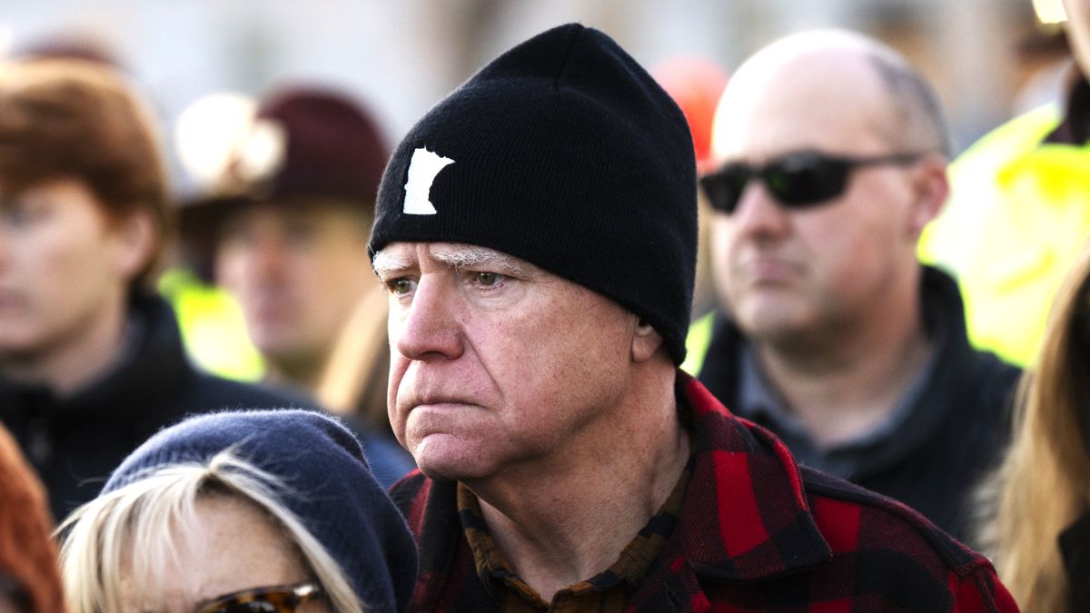 Minnesota Gov. Tim Walz (R) and his wife Gwen Walz (L) look on during a vigil for Renee Good on the steps of the state capitol building on January 09, 2026 in St. Paul, Minnesota. Earlier this week a federal agent fatally shot Good in her car during an incident in south Minneapolis. (Photo by Stephen Maturen/Getty Images)