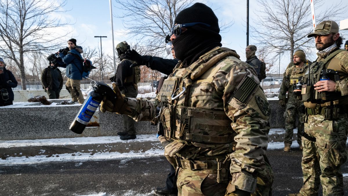 Federal agents stage at a front gate as Rep. Ilhan Omar (D-MN), Rep. Kelly Morrison (D-MN), and Rep. Angie Craig (D-MN) attempt to enter the regional ICE headquarters at the Bishop Henry Whipple Federal Building on January 10, 2026 in Minneapolis, Minnesota. The Congresspeople were briefly allowed access to the facility where the Department of Homeland Security has been headquartering operations in the state. (Photo by Stephen Maturen/Getty Images)