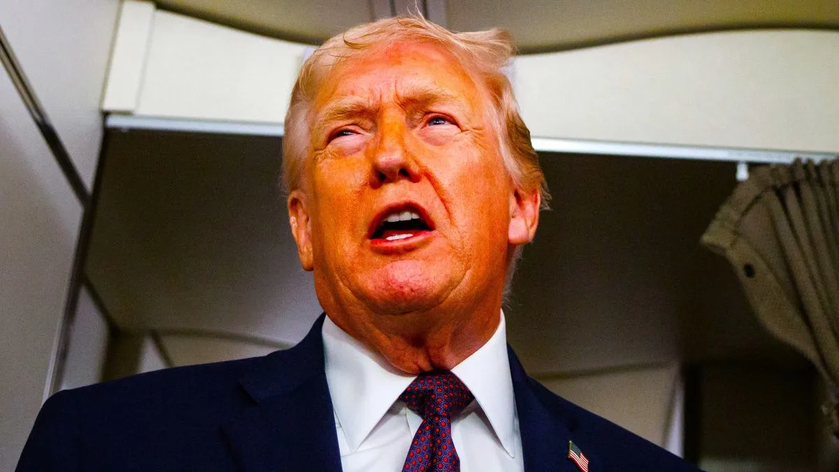 President Donald Trump takes questions from the members of the press aboard Air Force One on January 11, 2026 en route back to the White House from Palm Beach, Florida. The President spent the weekend at his private club Mar-a-Lago in Palm Beach, Florida. (Photo by Samuel Corum/Getty Images)