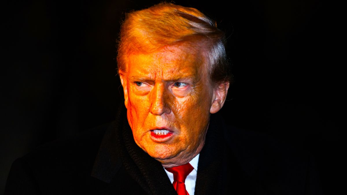 U.S. President Donald Trump walks over to reporters to make a brief statement before departing from the South Lawn of the White House in Marine One on January 20, 2026 in Washington, DC. President Trump is heading to Switzerland for the Davos Forum as tensions rise around Trumps rhetoric on Greenland. (Photo by Samuel Corum/Getty Images)