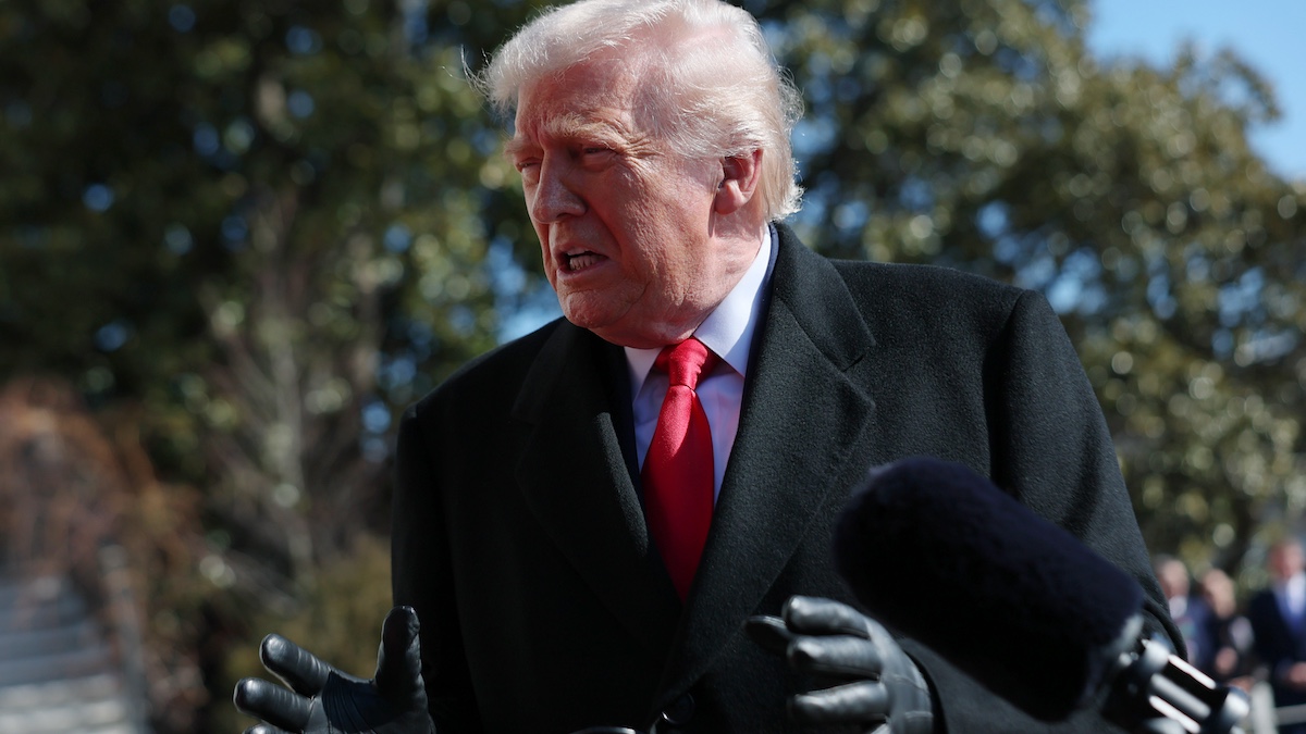 WASHINGTON, DC - FEBRUARY 13: U.S. President Donald Trump talks with reporters as he and first lady Melania Trump leave the White House on February 13, 2026 in Washington, DC. Trump is traveling to Fort Bragg in North Carolina to visit Special Operations troops who were involved in the capture of Venezuelan President Nicolas Maduro before continuing to his private Mar-a-Lago Club in Palm Beach, Florida, for the weekend.