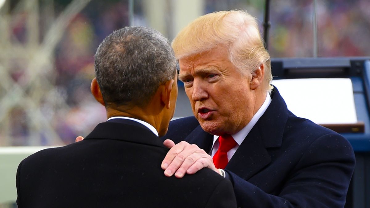 US President Donald Trump speaks with former President Barack Obama during the Presidential Inauguration at the US Capitol on January 20, 2017 in Washington, DC. Donald J. Trump became the 45th president of the United States today. (Photo by Saul Loeb - Pool/Getty Images)