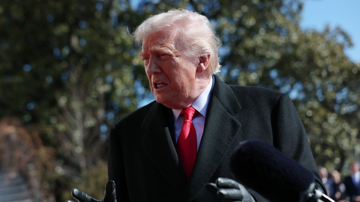 WASHINGTON, DC - FEBRUARY 13: U.S. President Donald Trump talks with reporters as he and first lady Melania Trump leave the White House on February 13, 2026 in Washington, DC. Trump is traveling to Fort Bragg in North Carolina to visit Special Operations troops who were involved in the capture of Venezuelan President Nicolas Maduro before continuing to his private Mar-a-Lago Club in Palm Beach, Florida, for the weekend. (Photo by Michael M. Santiago/Getty Images)