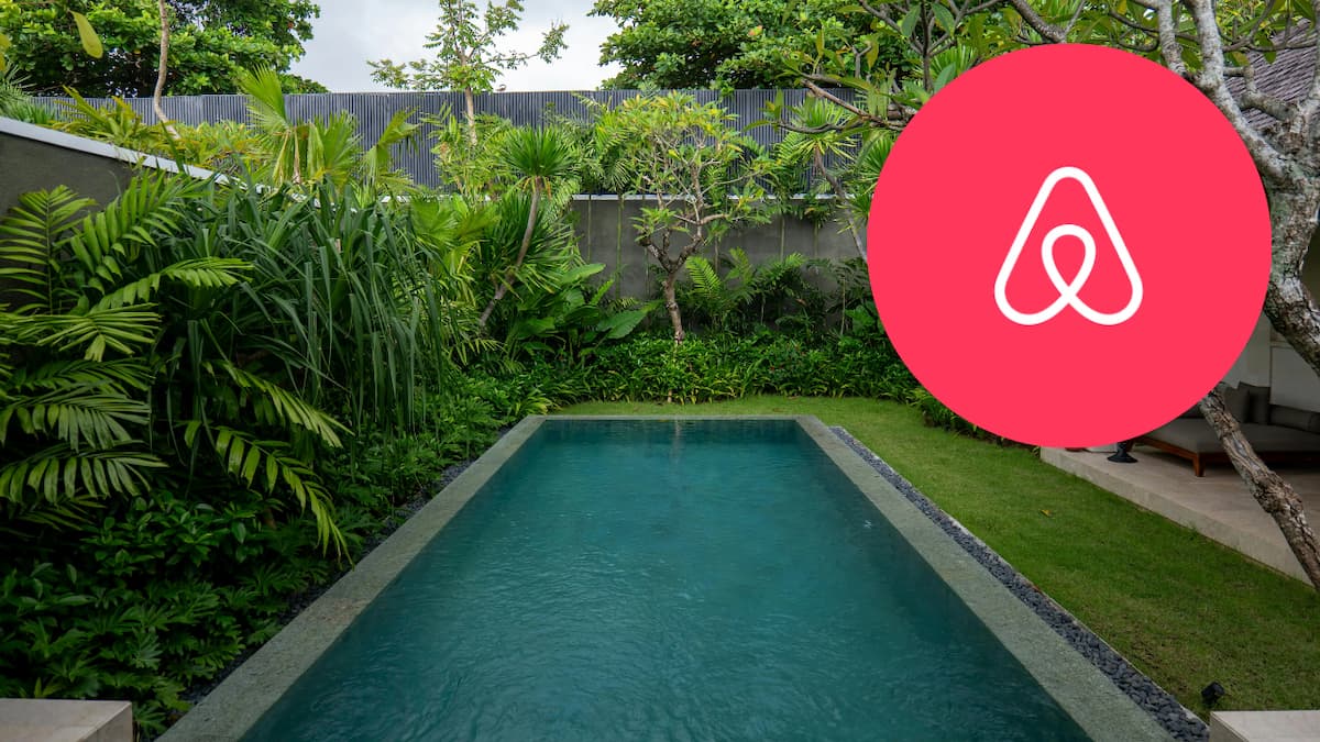 Luxurious villa pool surrounded by lush tropical greenery in Bali, Indonesia.