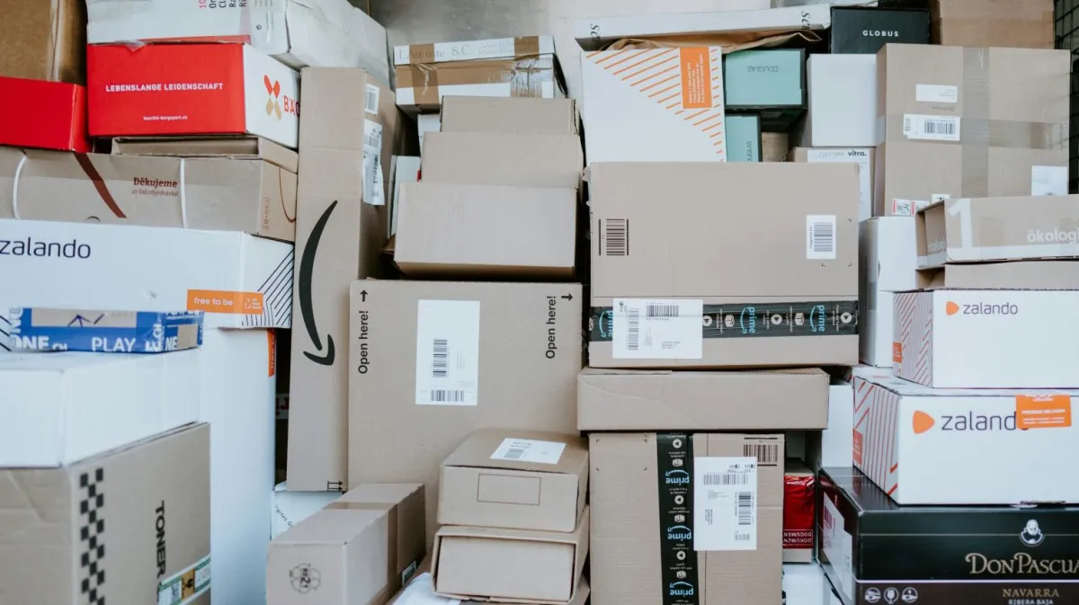 brown cardboard boxes on black plastic crate
