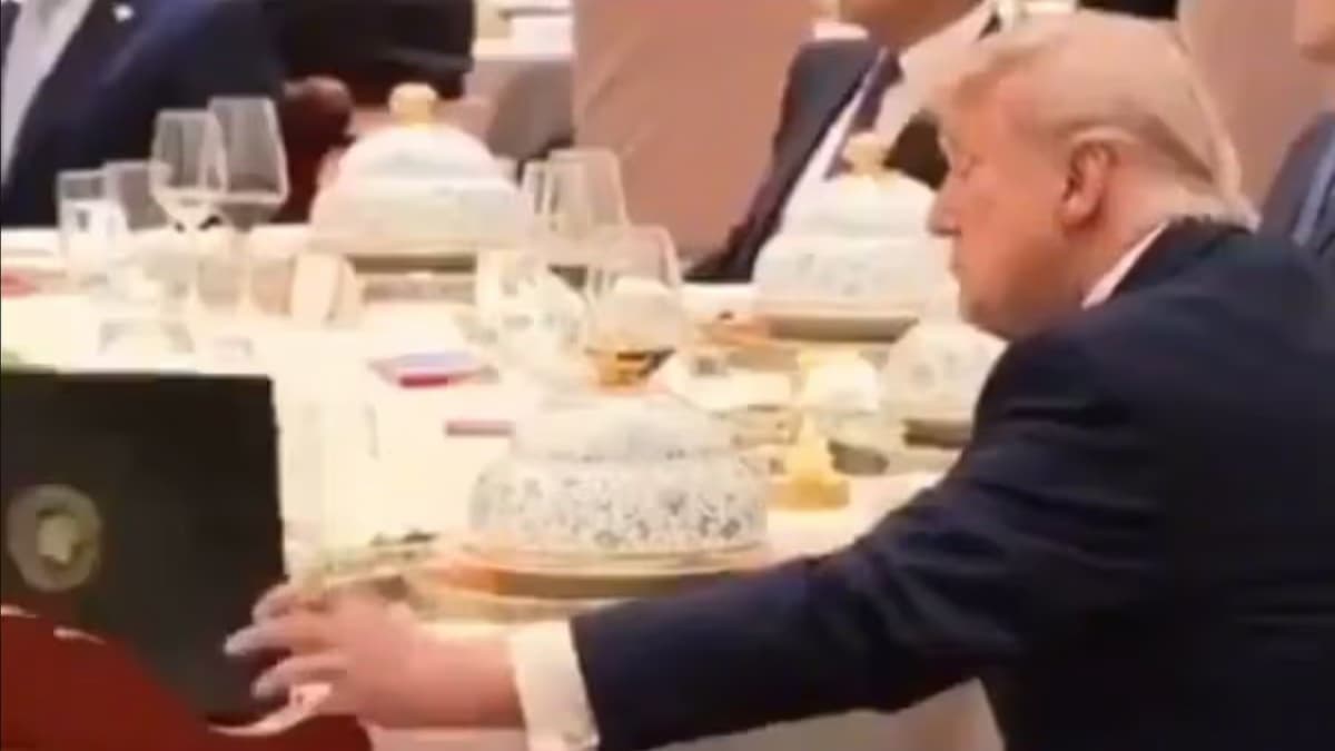 Donald Trump looking through notebook