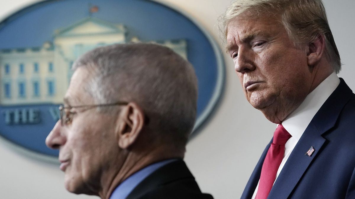 U.S. President Donald Trump, listens to Dr. Anthony Fauci, director of the National Institute of Allergy and Infectious Diseases, speak during a briefing on the coronavirus pandemic, in the press briefing room of the White House on March 24, 2020 in Washington, DC. Cases of COVID-19 continue to rise in the United States, with New York’s case count doubling every three days according to governor Andrew Cuomo. (Photo by Drew Angerer/Getty Images)