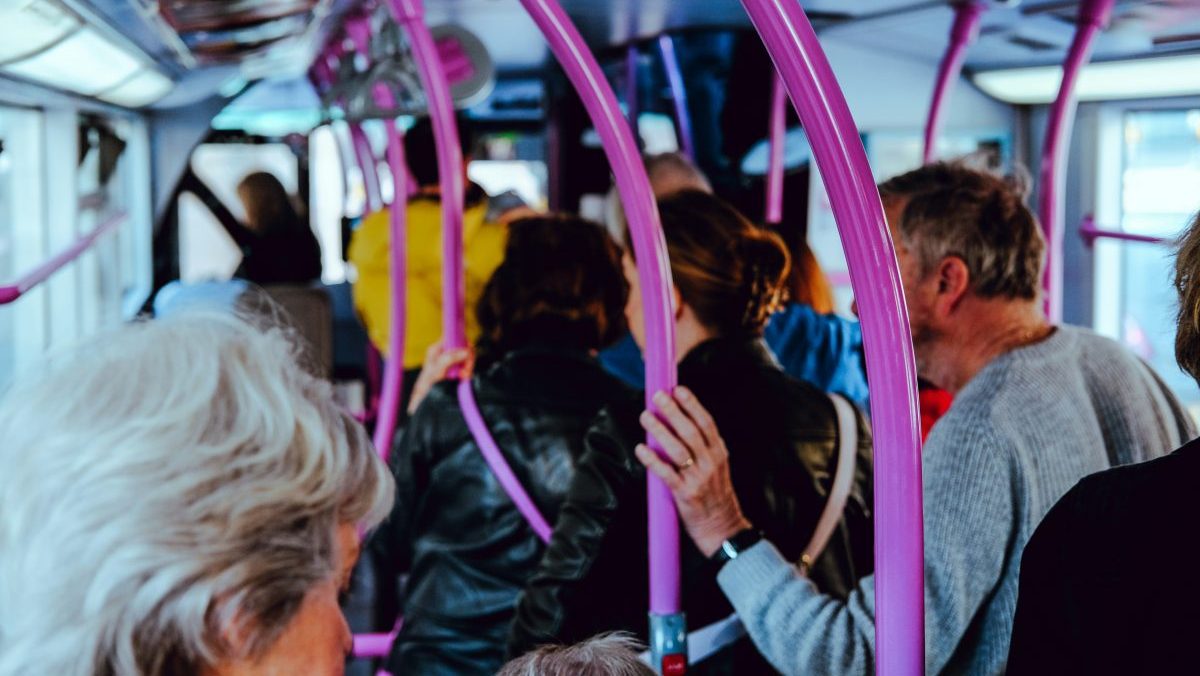 a group of people riding on a bus