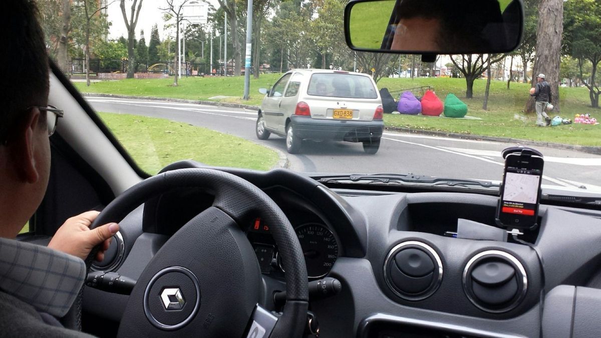 An Uber driver with the app open