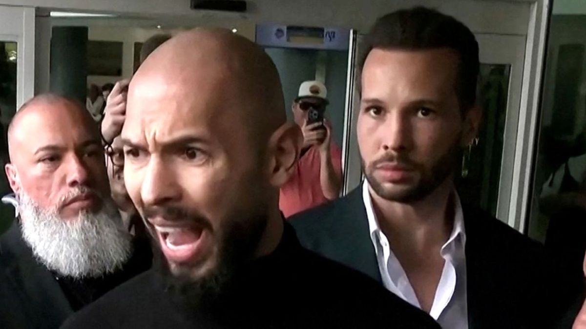 Andrew Tate speaks to the media upon arrival from Romania, after prosecutors lifted a travel ban related to criminal charges against him and his brother Tristan, in Fort Lauderdale, Florida, U.S. February 27, 2025 in a still image from video. REUTERS/Maria Alejandra Cardona