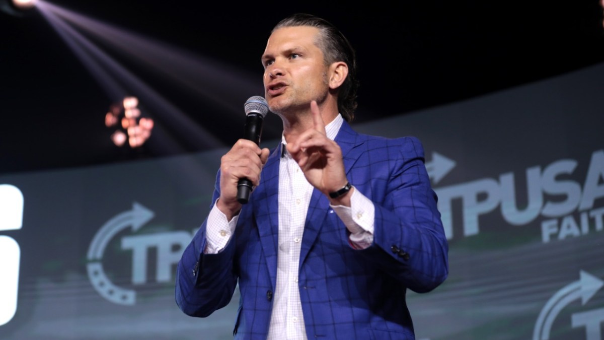 Pete Hegseth talking at a TPUSA event