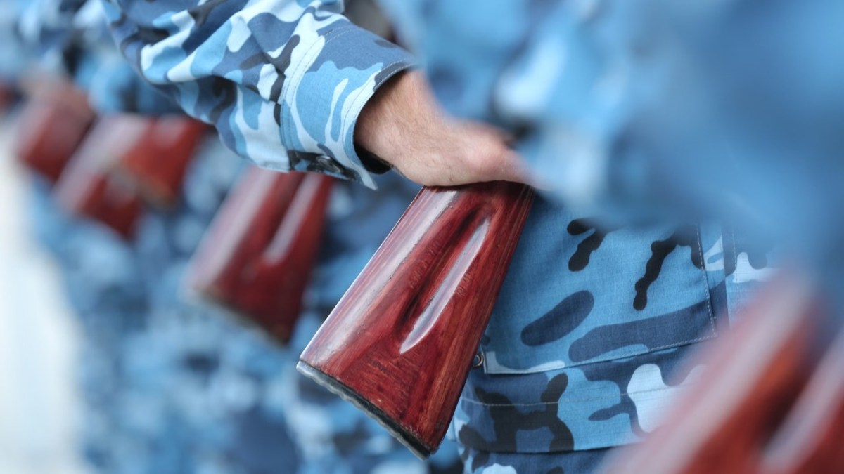 Soldiers wielding rifles